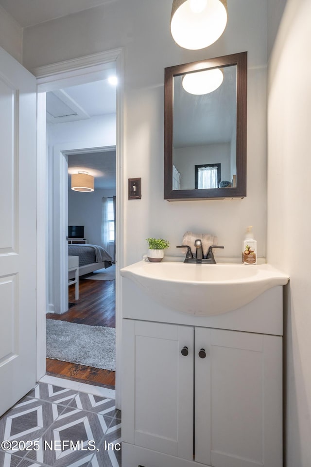 bathroom with vanity and hardwood / wood-style flooring