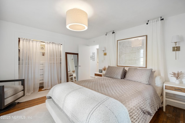 bedroom with wood-type flooring