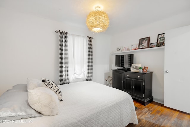 bedroom with hardwood / wood-style floors