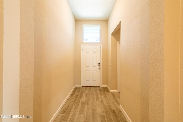 entryway with light hardwood / wood-style floors