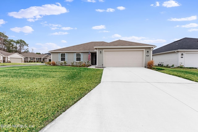 ranch-style house featuring a garage and a front yard