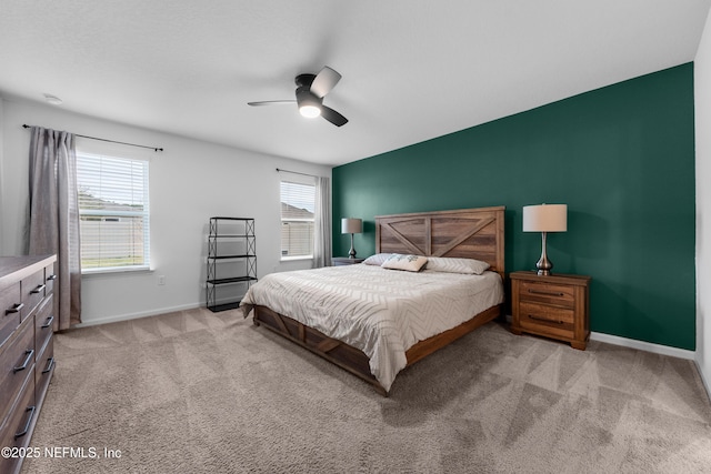 bedroom with light carpet and ceiling fan