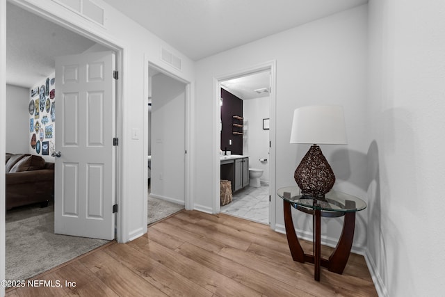 hall featuring light hardwood / wood-style floors