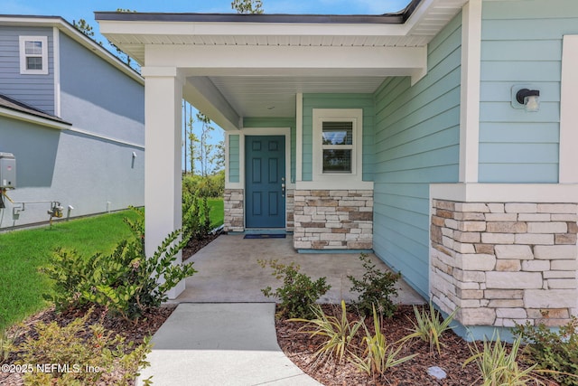 348 Salazar St, Saint Augustine, FL 32095 - doorway to property featuring a porch and stone siding