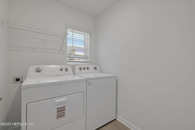 348 Salazar St, Saint Augustine, FL 32095 - laundry area featuring separate washer and dryer and light wood-style flooring