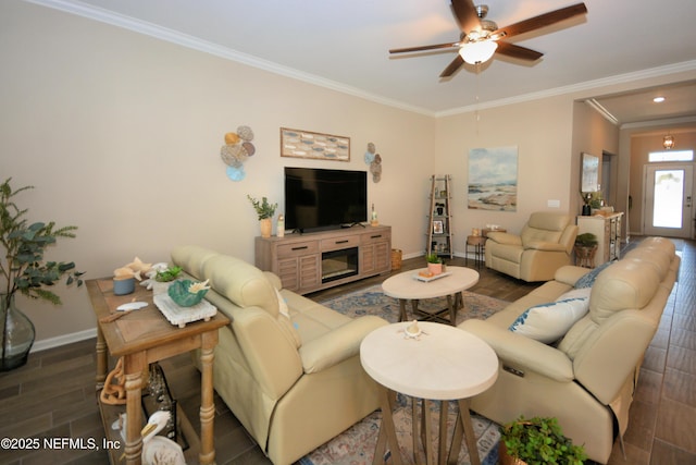 living room with crown molding, dark hardwood / wood-style floors, and ceiling fan