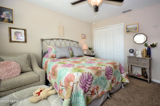 bedroom with ceiling fan, carpet, and a closet