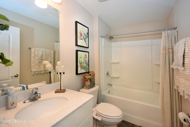 full bathroom featuring shower / bath combo, vanity, and toilet