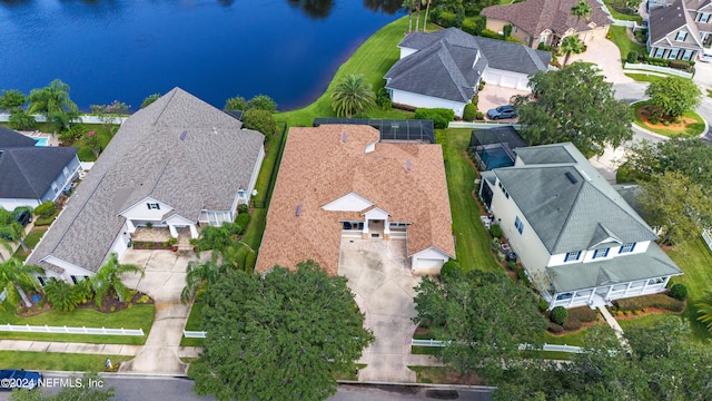 birds eye view of property with a water view