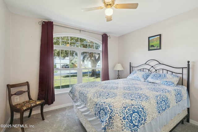 bedroom with carpet flooring, a ceiling fan, and baseboards