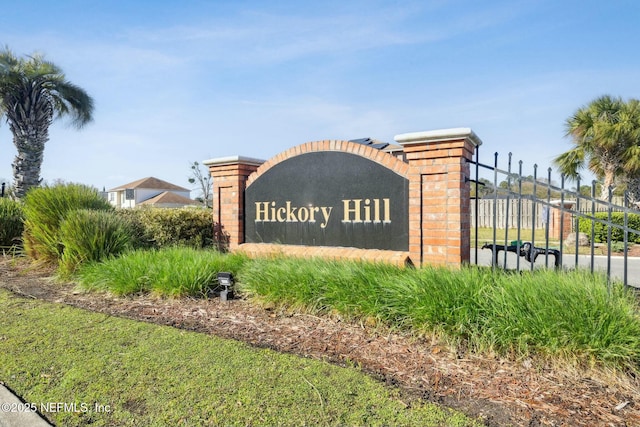 community sign with fence