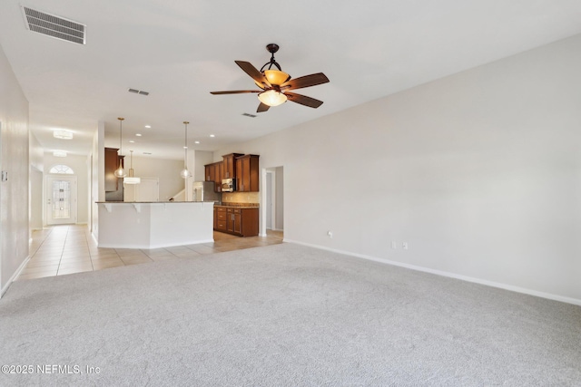 4468 Song Sparrow Dr, Middleburg, FL 32068 - unfurnished living room featuring light carpet and ceiling fan