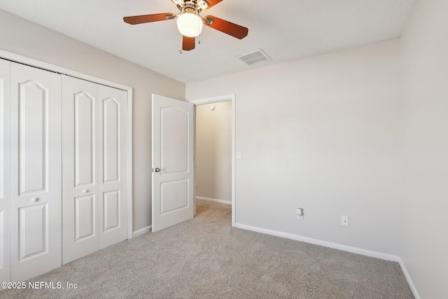 4468 Song Sparrow Dr, Middleburg, FL 32068 - unfurnished bedroom with ceiling fan, light colored carpet, and a closet