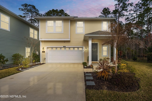 front of property featuring a garage