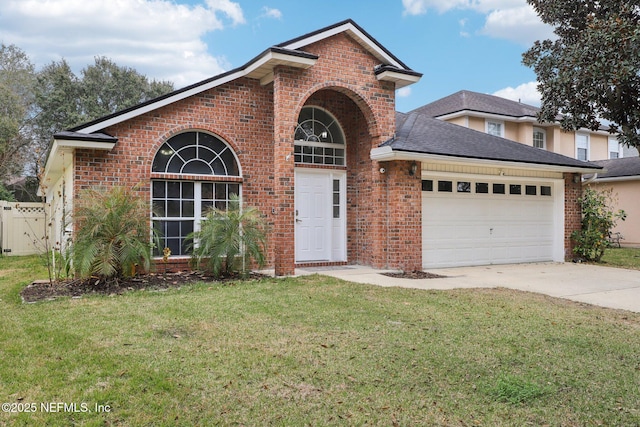 view of property featuring a garage and a front yard