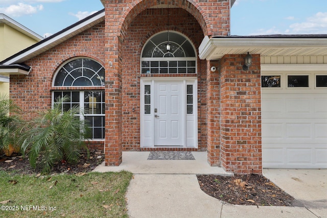 entrance to property featuring a garage