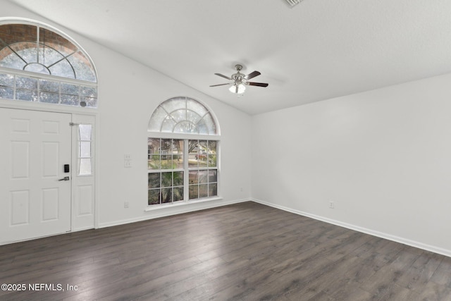 entrance foyer with vaulted ceiling, dark hardwood / wood-style floors, and ceiling fan