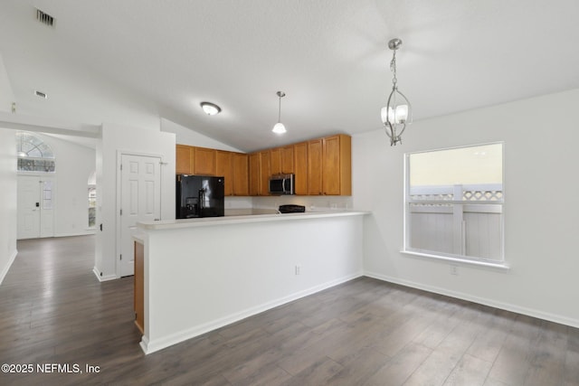 kitchen featuring vaulted ceiling, pendant lighting, kitchen peninsula, dark wood-type flooring, and black refrigerator with ice dispenser