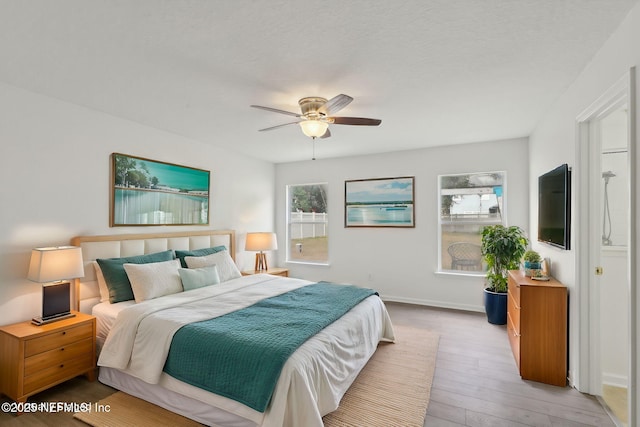 bedroom with light hardwood / wood-style flooring and ceiling fan