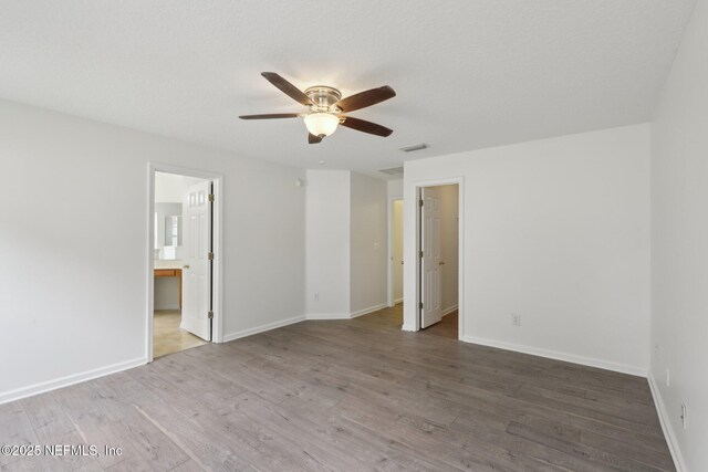 unfurnished room featuring hardwood / wood-style flooring and ceiling fan