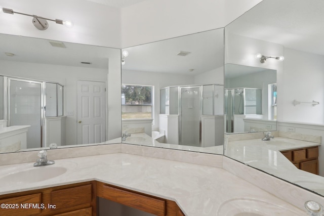 bathroom with vanity and walk in shower