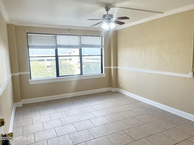 spare room featuring crown molding and ceiling fan