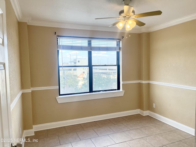 empty room with crown molding, light tile patterned floors, and ceiling fan