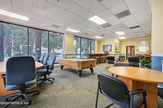 recreation room with expansive windows, carpet, and a drop ceiling