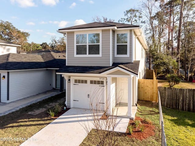 view of front of house featuring a garage and a front lawn