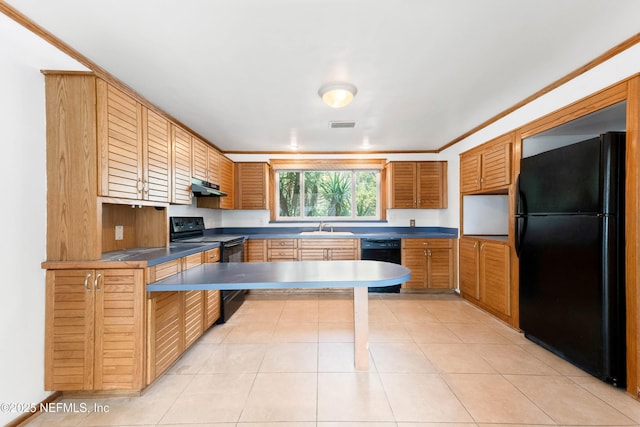 kitchen featuring light tile patterned floors, under cabinet range hood, a sink, black appliances, and dark countertops