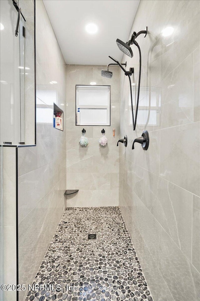 bathroom with a shower stall