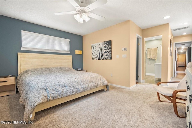 bedroom featuring baseboards, a textured ceiling, visible vents, and carpet flooring