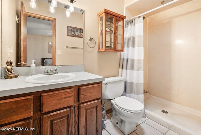 full bathroom with toilet, a shower stall, vanity, and tile patterned floors