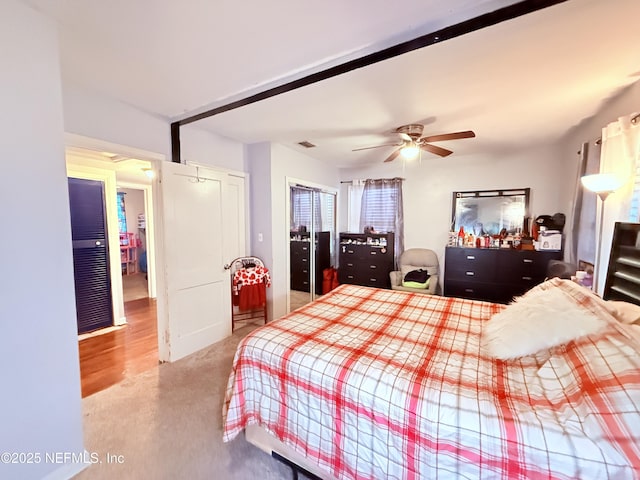 bedroom with ceiling fan and a closet