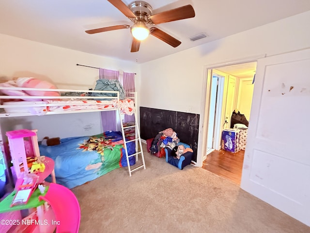 carpeted bedroom featuring ceiling fan