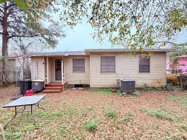 rear view of house with central air condition unit