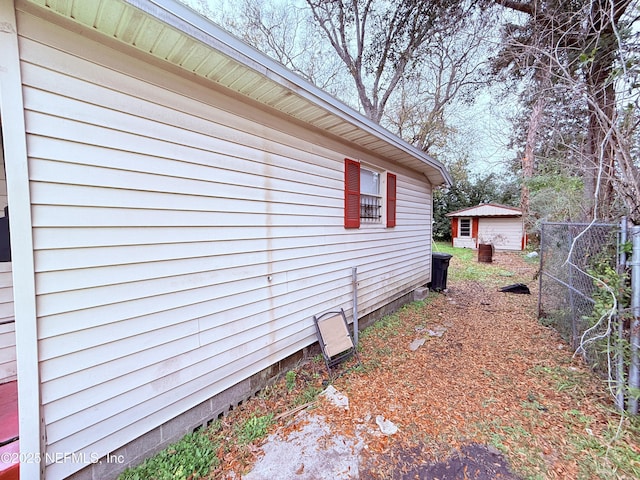 view of property exterior with an outdoor structure