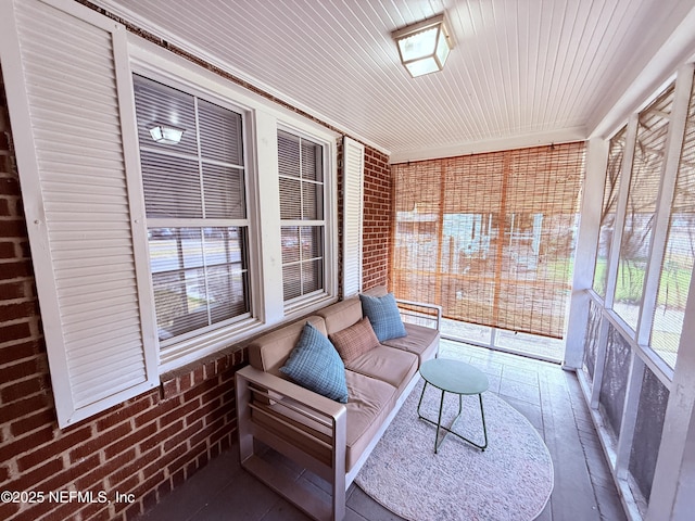 sunroom featuring wooden ceiling