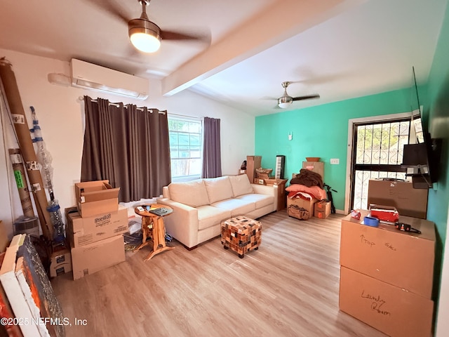 living room featuring ceiling fan, a wall mounted AC, light hardwood / wood-style floors, and vaulted ceiling with beams