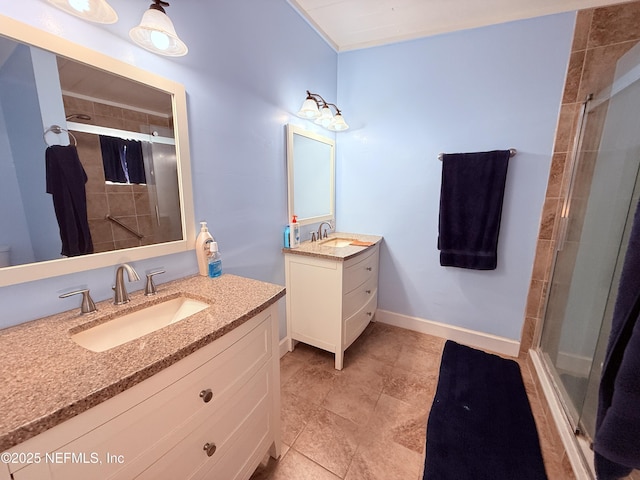 bathroom featuring vanity and an enclosed shower