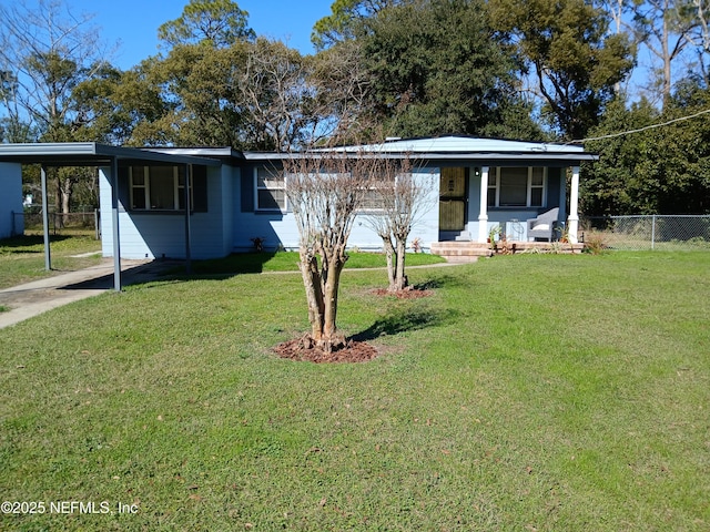 view of front of home featuring a porch, fence, driveway, a carport, and a front lawn