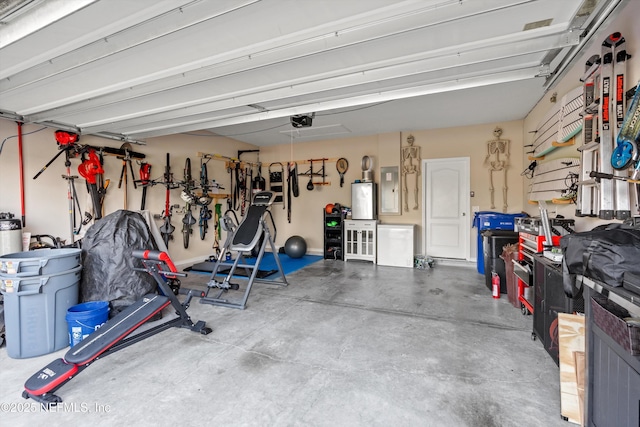 garage featuring a garage door opener and electric panel