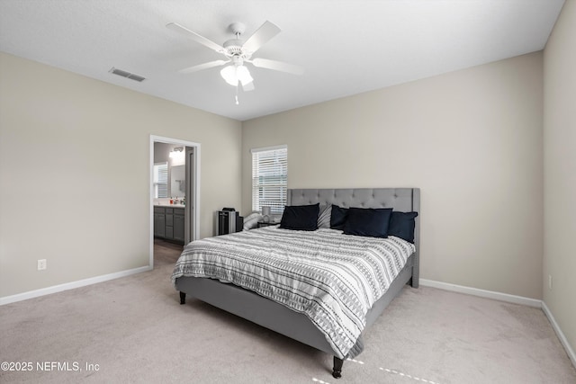 carpeted bedroom featuring ceiling fan and connected bathroom