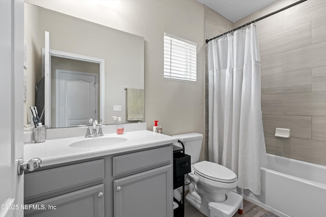 full bathroom with vanity, toilet, and shower / bath combo with shower curtain