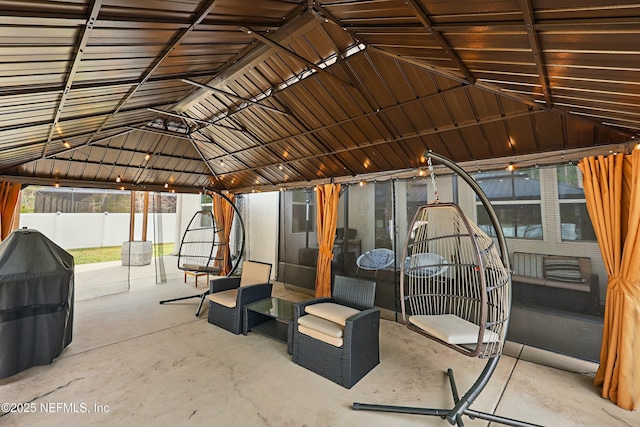 view of patio with a gazebo and fence