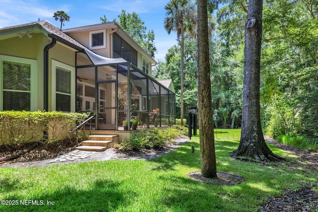 view of yard featuring glass enclosure