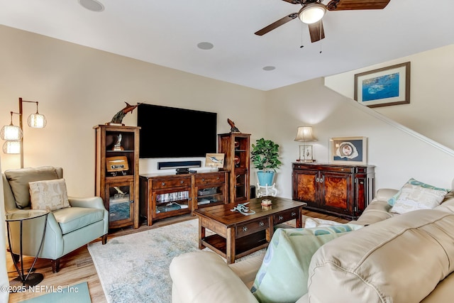 living area with ceiling fan and light wood-style flooring