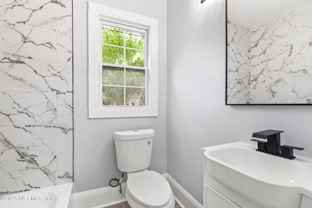 full bathroom with vanity, tub / shower combination, and toilet