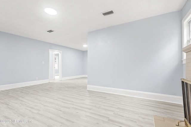 empty room with light wood-type flooring