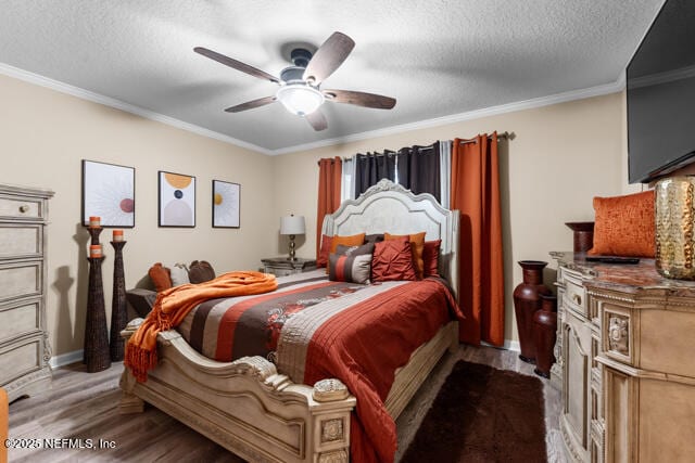 bedroom with hardwood / wood-style flooring, ceiling fan, crown molding, and a textured ceiling